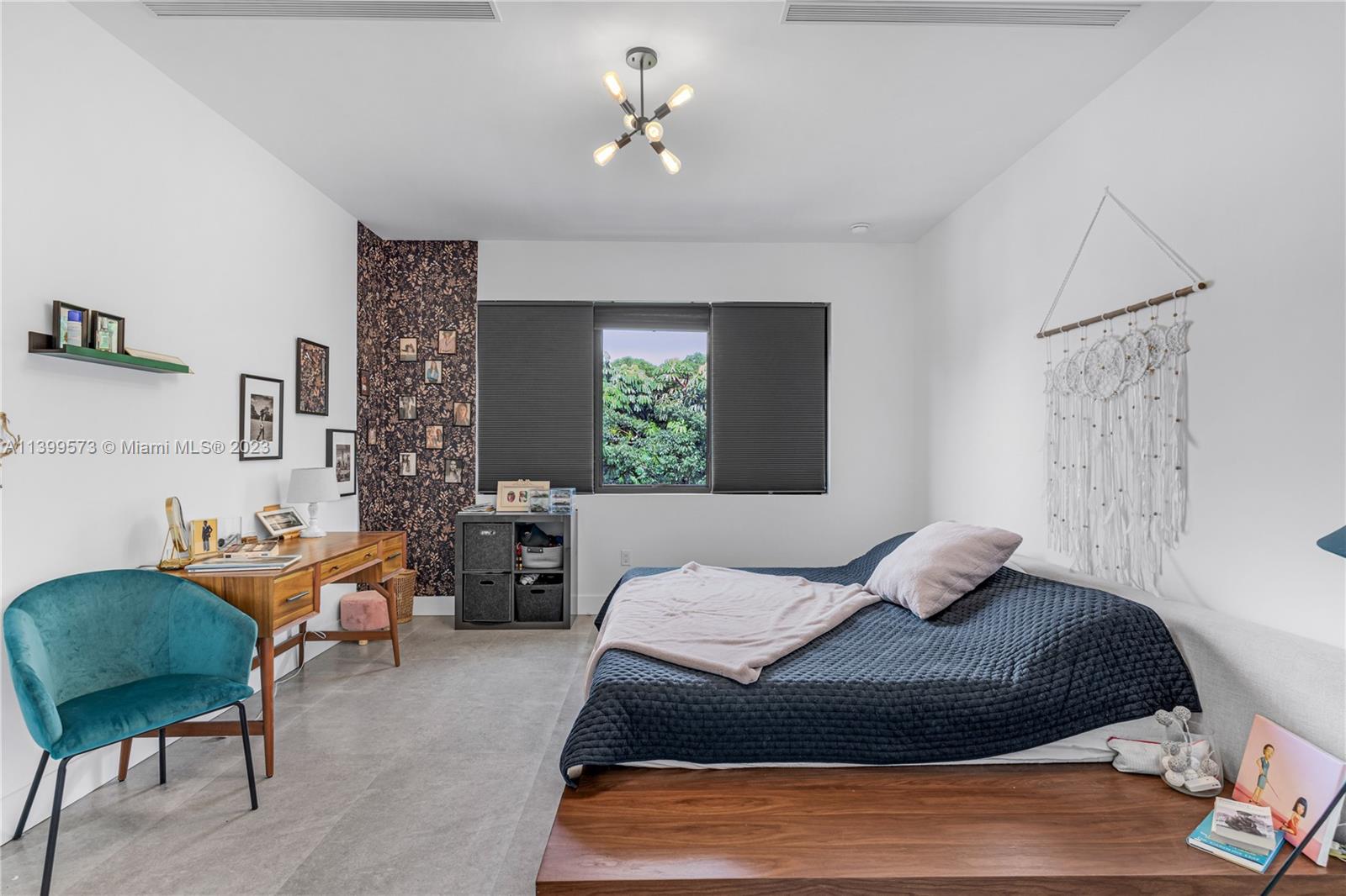 2936 Southwest 35th Avenue, Unit 2936 Miami, FL 33133 - Photo 15 of 22 a bedroom with a bed and chair