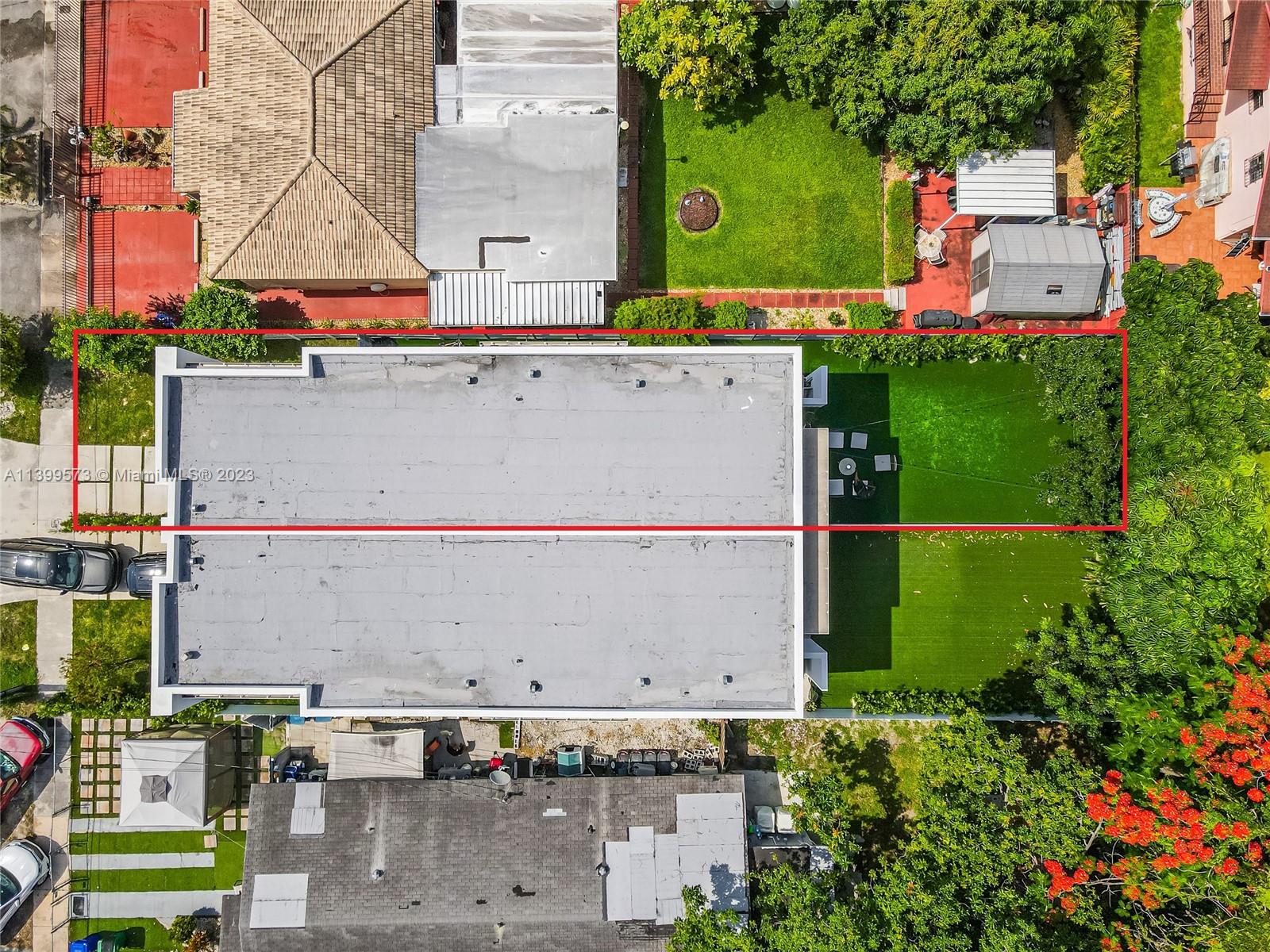 2936 Southwest 35th Avenue, Unit 2936 Miami, FL 33133 - Photo 19 of 22 an aerial view of a houses with yard