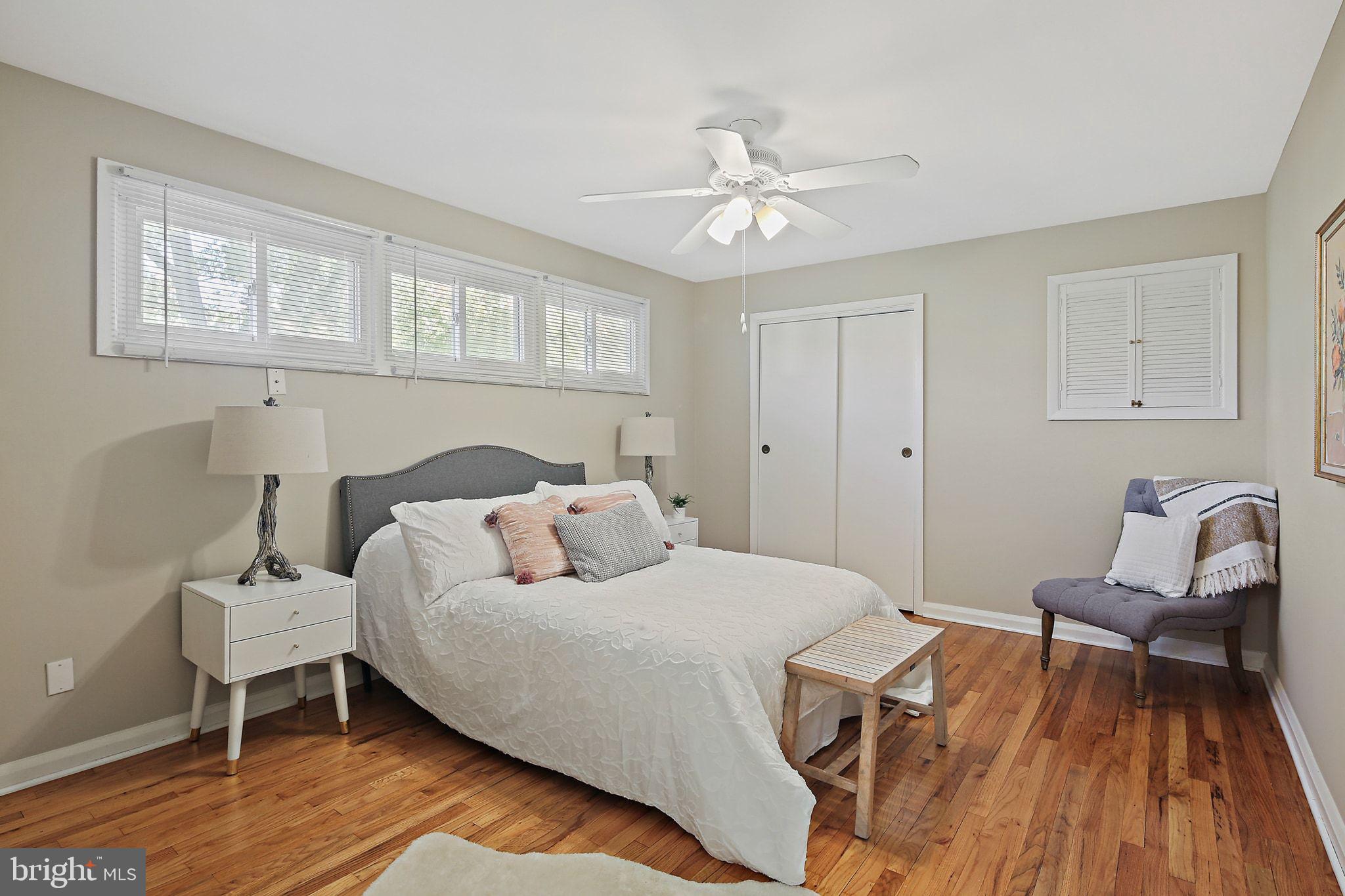 6204 Scranton Road Baltimore, MD 21237 - Photo 12 of 31 a bedroom with a bed and wooden floor