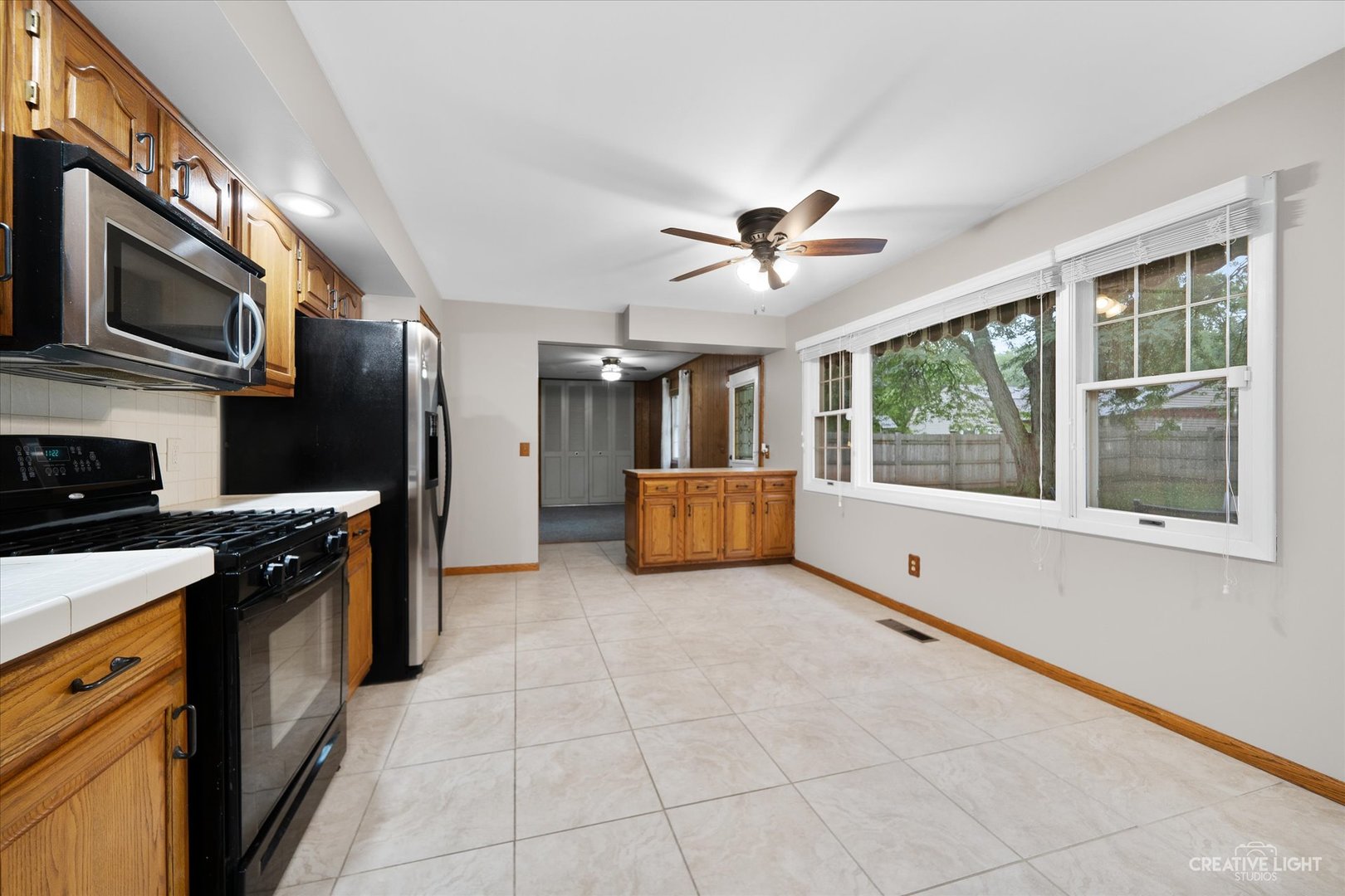 35 Ingleshire Road Montgomery, IL 60538 - Photo 5 of 16 a large kitchen with stainless steel appliances granite countertop a stove and a refrigerator
