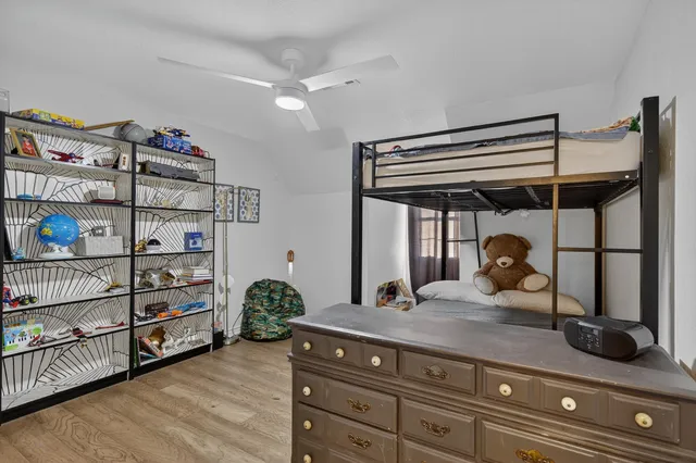 a living room with hard wood floors and furniture