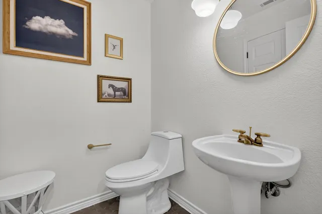 a bathroom with a toilet and a sink