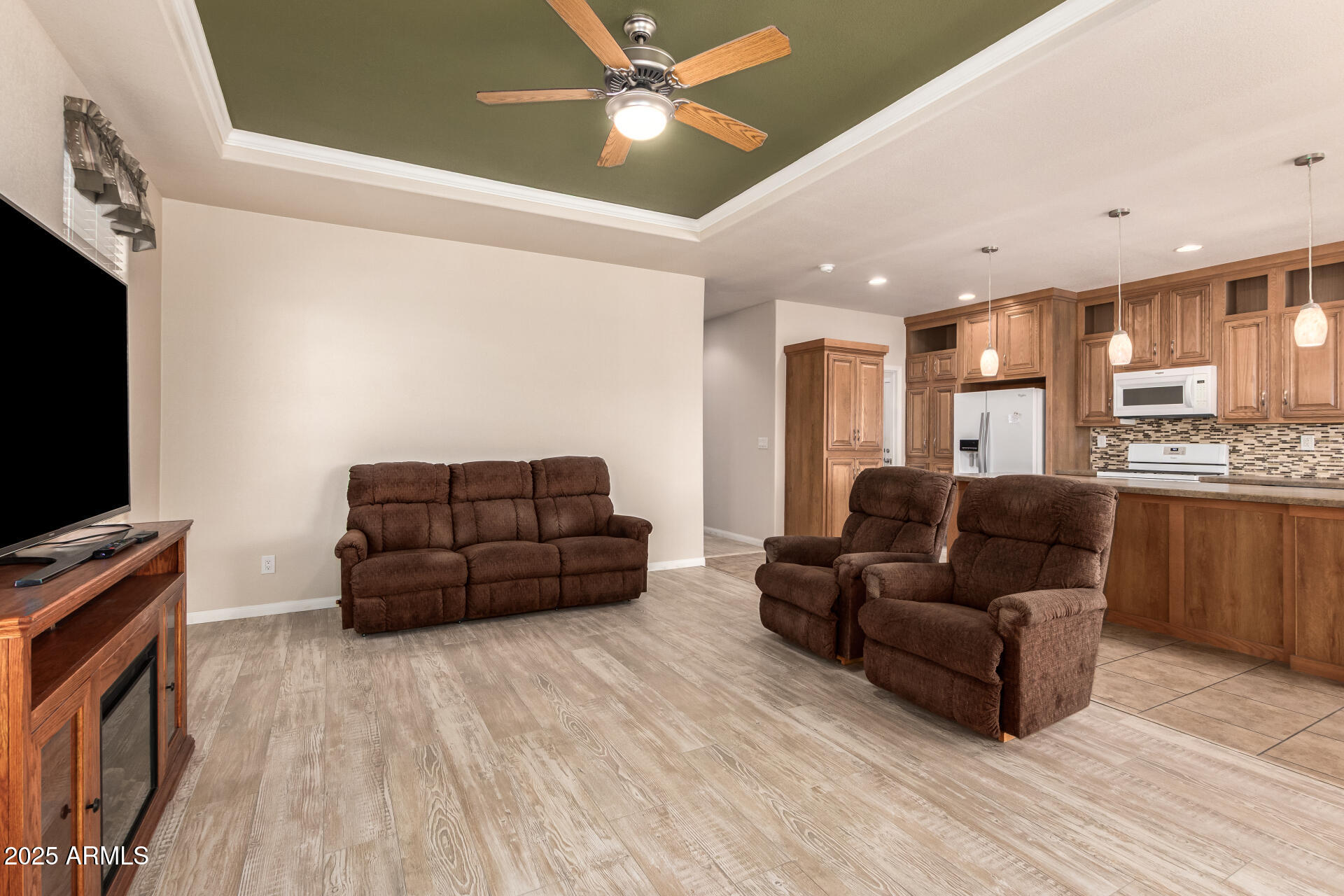 2929 East Main Street, Unit 217 Mesa, AZ 85213 - Photo 8 of 33 a living room with furniture and a flat screen tv