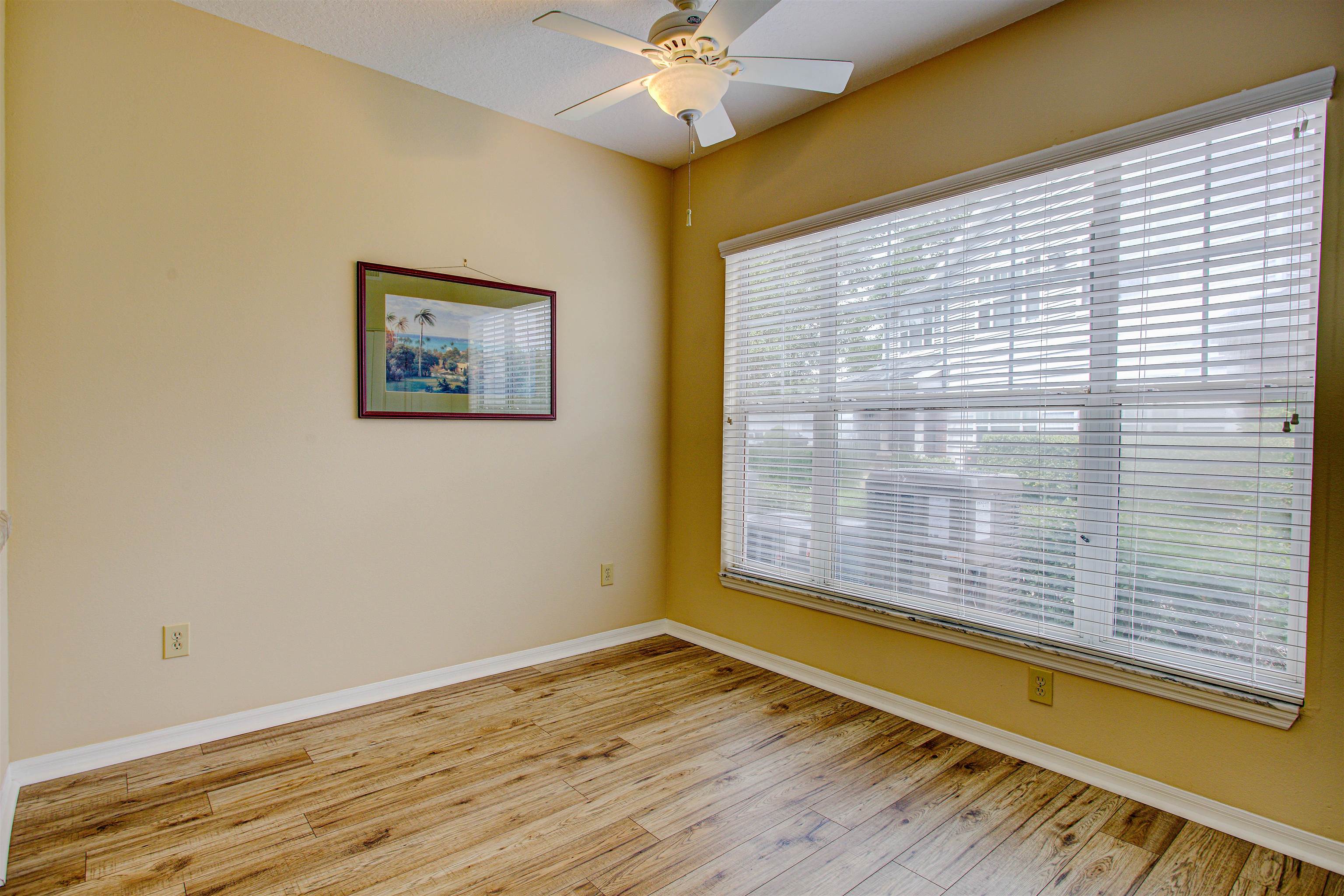 20102 Harbour Vista Circle St. Augustine, FL 32080 - Photo 12 of 31 a view of an empty room with a window and wooden floor