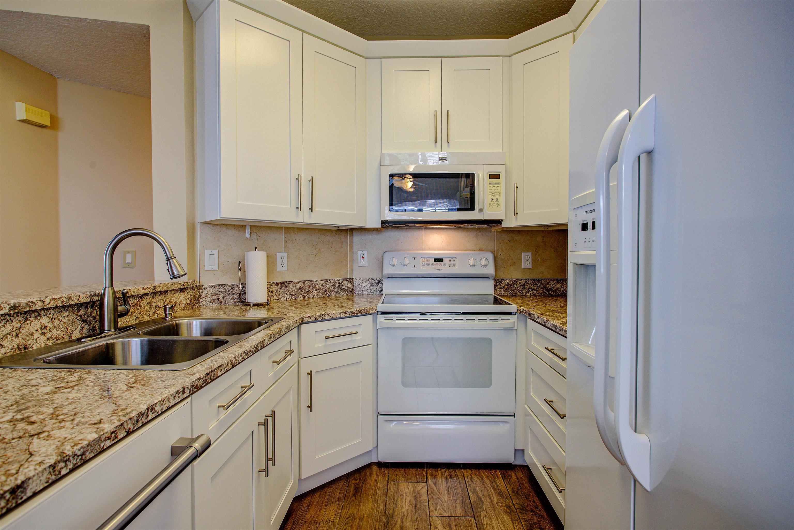20102 Harbour Vista Circle St. Augustine, FL 32080 - Photo 16 of 31 a kitchen with appliances a sink and cabinets
