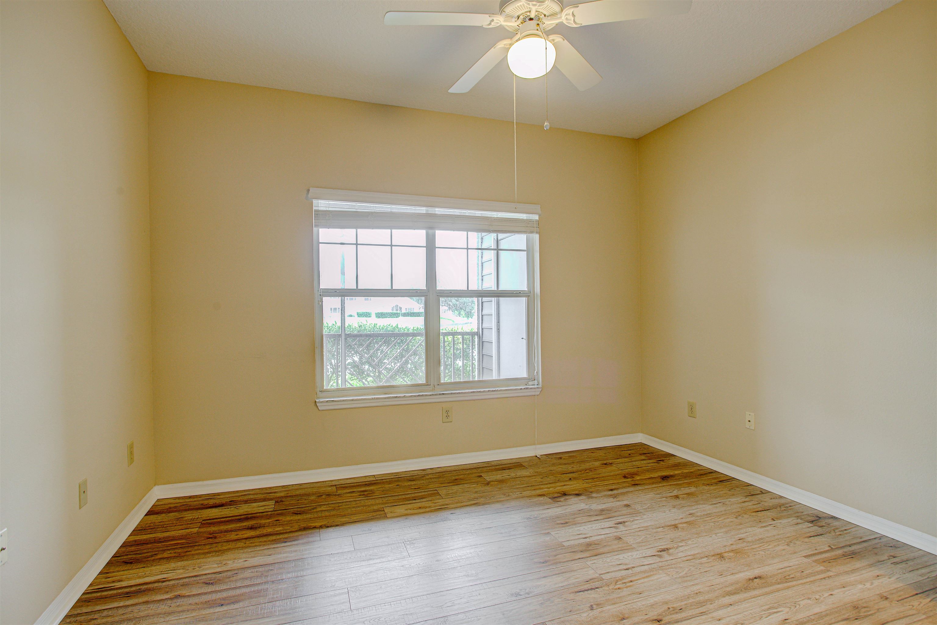 20102 Harbour Vista Circle St. Augustine, FL 32080 - Photo 20 of 31 an empty room with wooden floor and windows