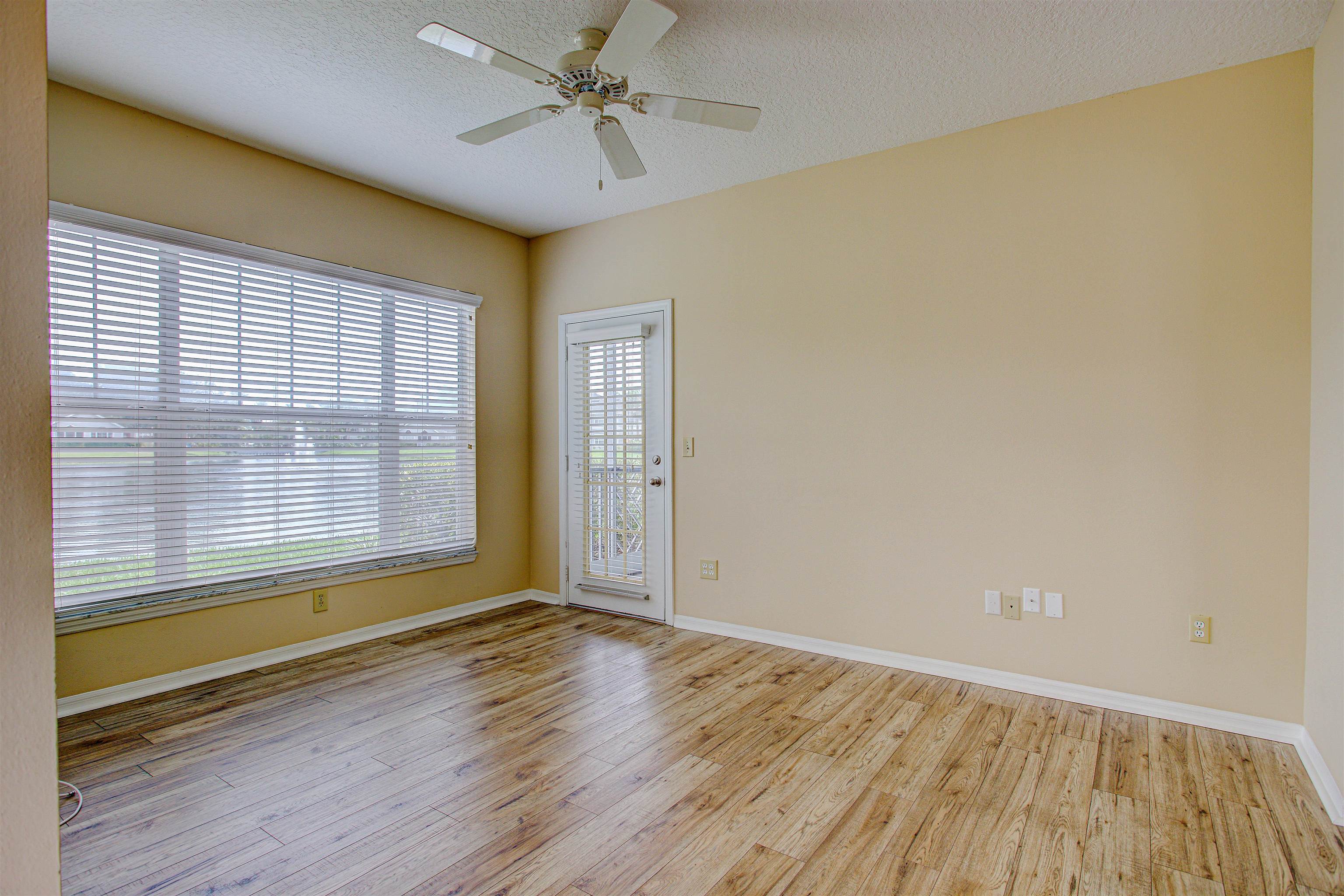 20102 Harbour Vista Circle St. Augustine, FL 32080 - Photo 4 of 31 an empty room with wooden floor and windows
