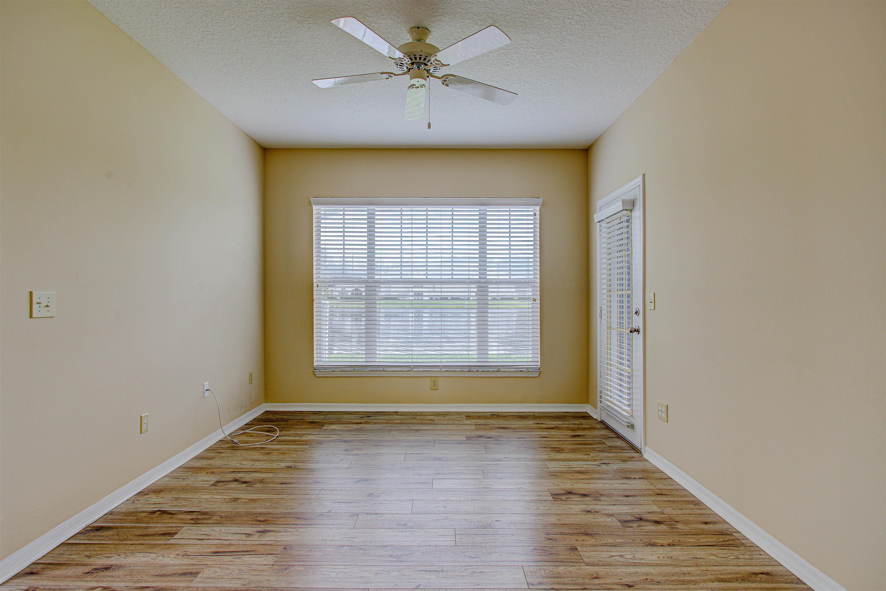 20102 Harbour Vista Circle St. Augustine, FL 32080 - Photo 5 of 31 an empty room with wooden floor and windows
