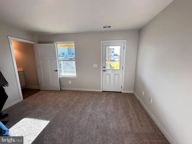 an empty room with windows