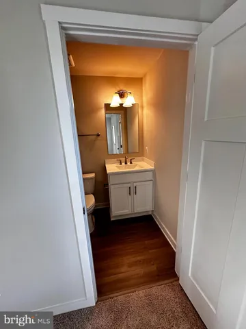 a room with a sink and a mirror