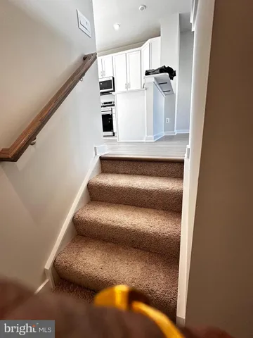 a view of front door with wooden floor