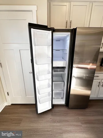 a stove top oven sitting inside of a kitchen