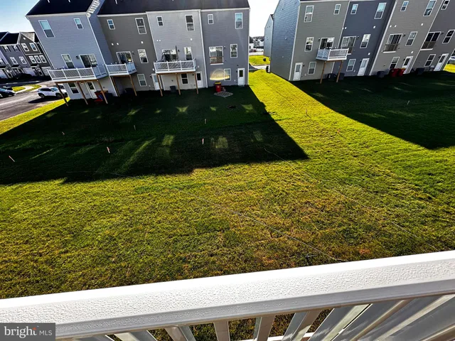 a view of a balcony with wooden floor