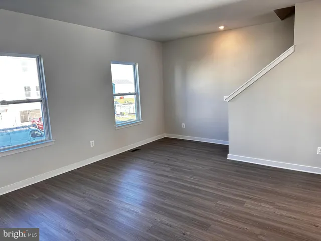 a living room with a couch and a rug