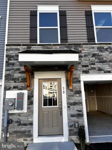 a front view of a house with a garage