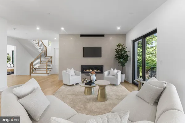 a living room with fireplace furniture and a flat screen tv
