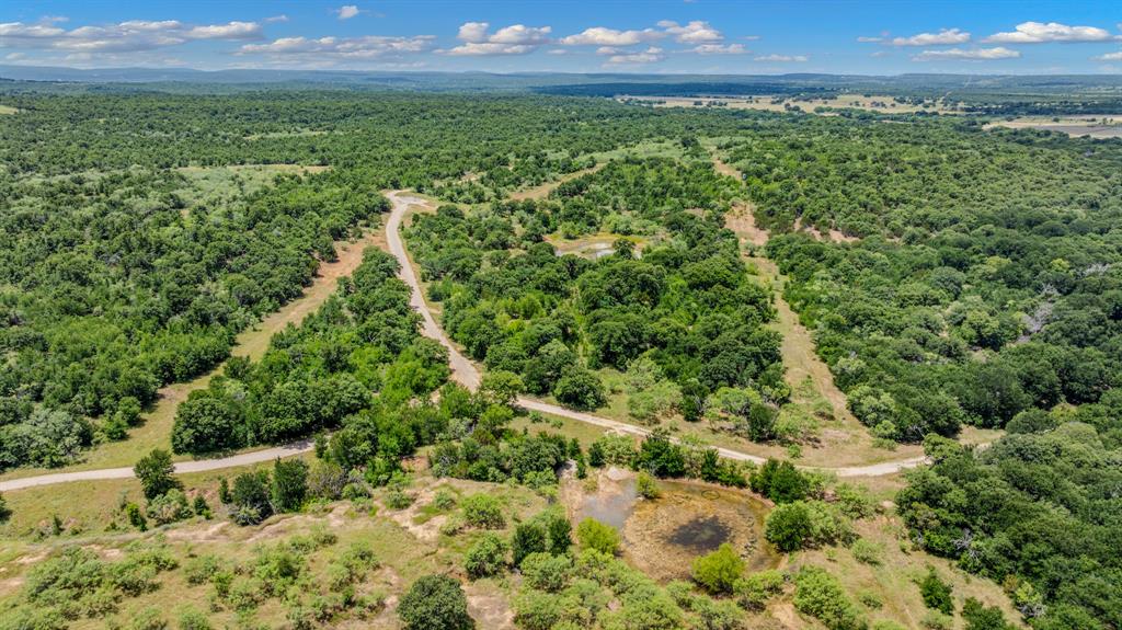 Tbd Cement Mountain Road Bryson, TX 76427 - Photo 21 of 40 a view of a green yard with large trees
