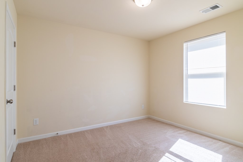 304 Irish Court Phenix City, AL 36869 - Photo 15 of 20 an empty room with a window