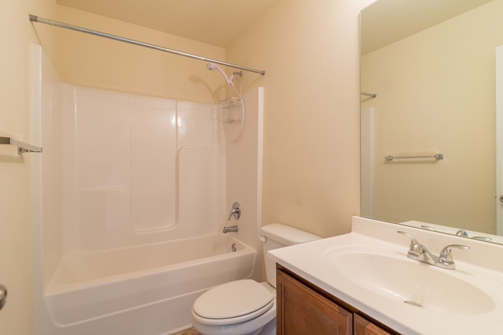 304 Irish Court Phenix City, AL 36869 - Photo 17 of 20 a bathroom with a sink a toilet and shower