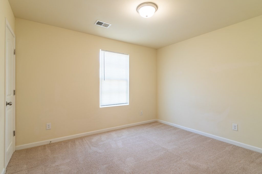 304 Irish Court Phenix City, AL 36869 - Photo 18 of 20 an empty room with a window