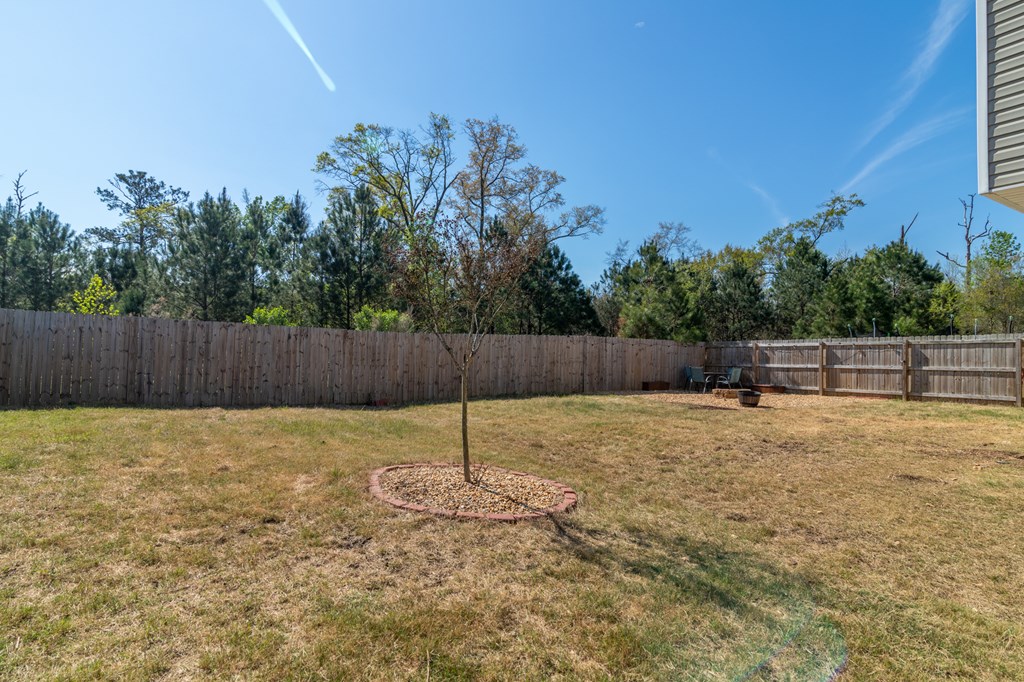 304 Irish Court Phenix City, AL 36869 - Photo 19 of 20 a backyard of a house with a basket ball court