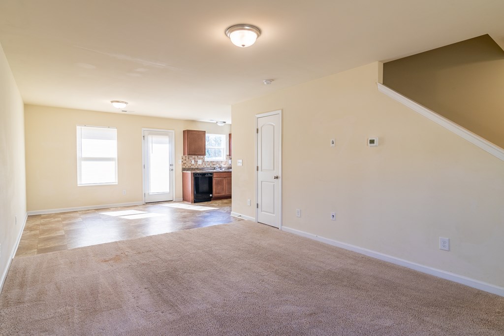 304 Irish Court Phenix City, AL 36869 - Photo 3 of 20 an empty room with a window and fireplace