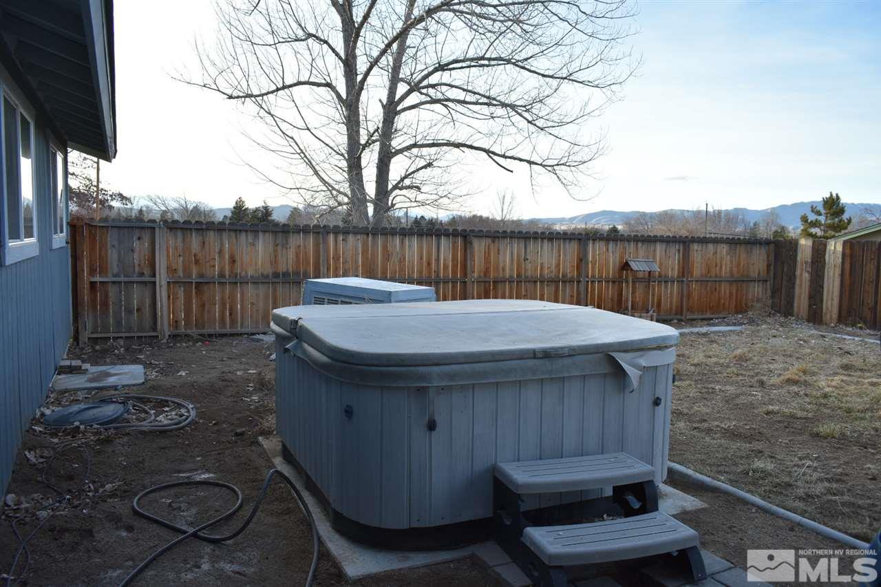 9355 Pagoda Way Reno, NV 89506 - Photo 14 of 18 a backyard of a house with lots of green space