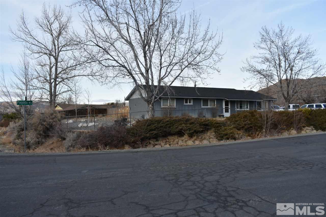 9355 Pagoda Way Reno, NV 89506 - Photo 17 of 18 a front view of a house with a yard and garage