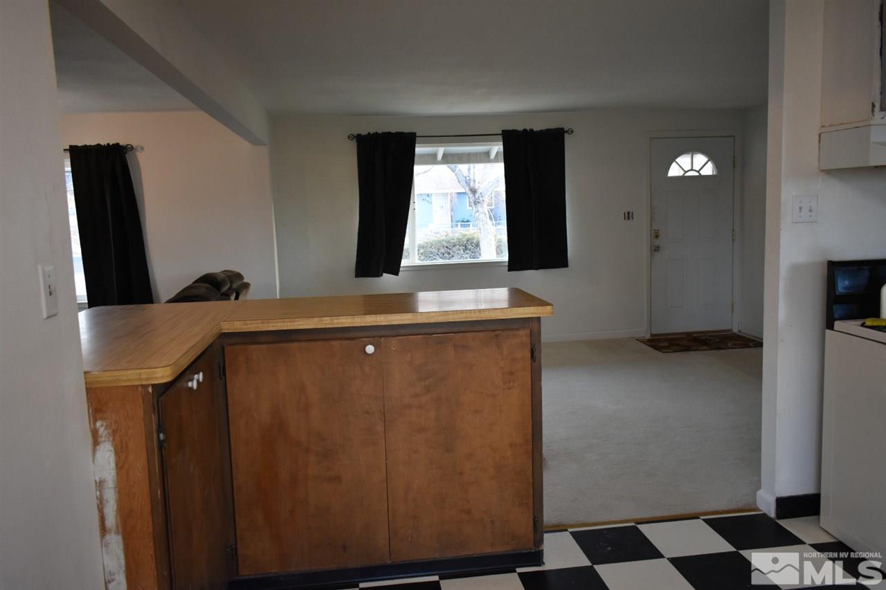 9355 Pagoda Way Reno, NV 89506 - Photo 3 of 18 a kitchen with a refrigerator and a sink