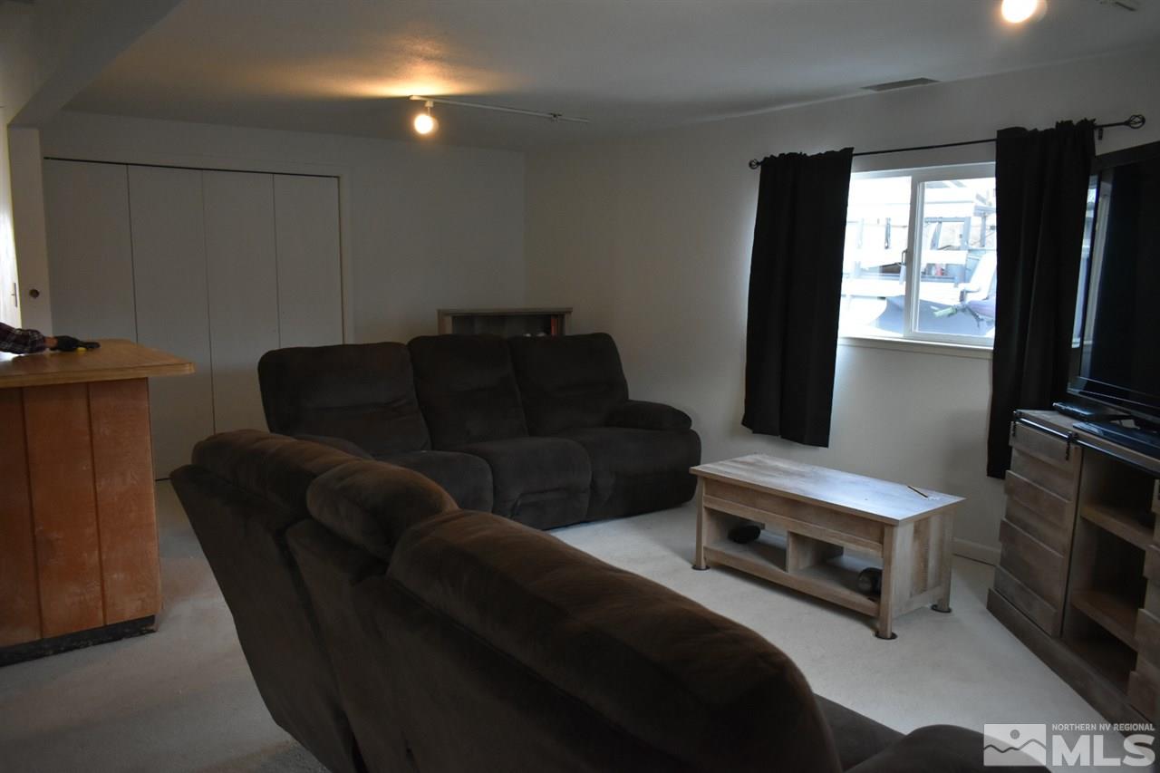 9355 Pagoda Way Reno, NV 89506 - Photo 4 of 18 a living room with furniture a flat screen tv and a window