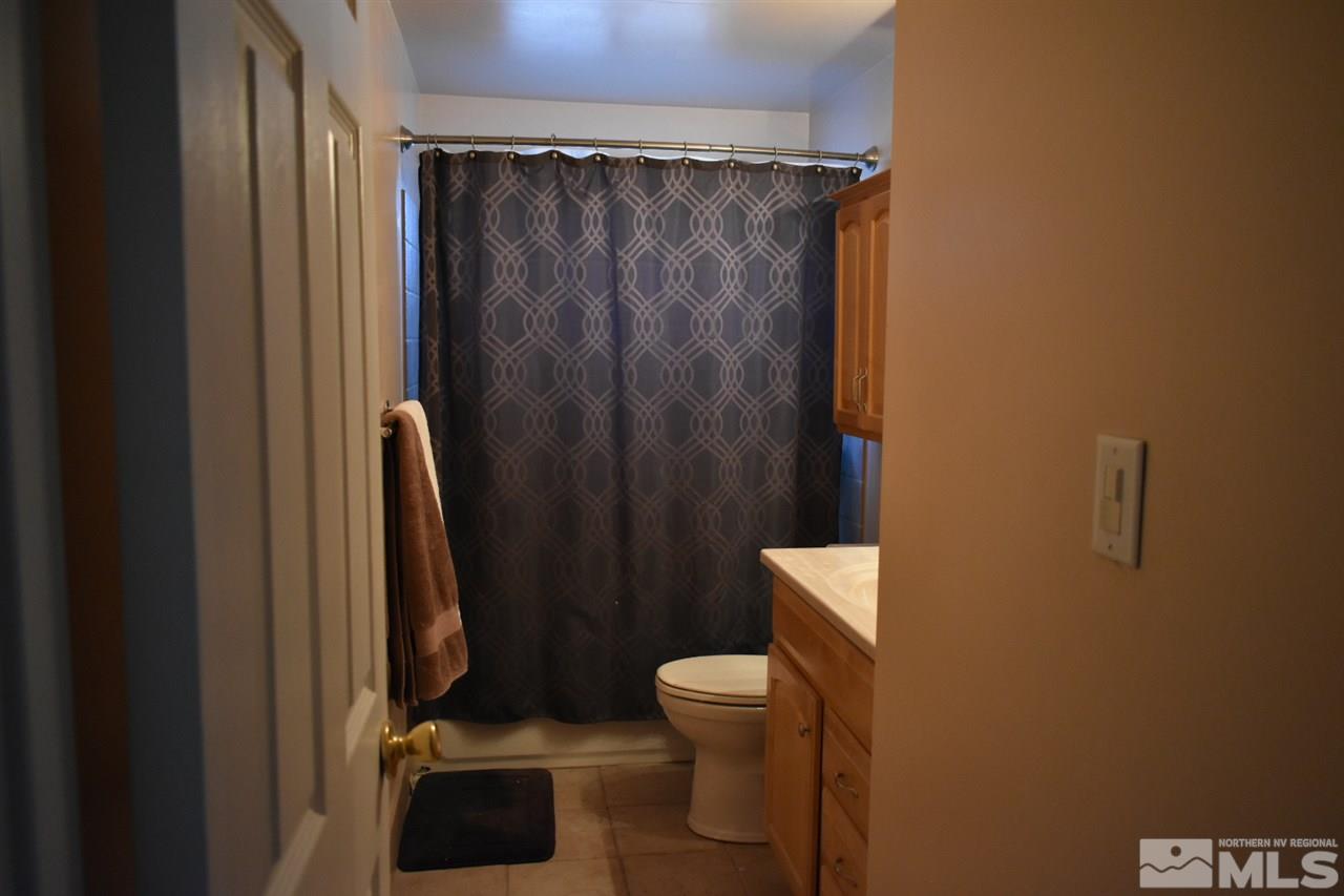 9355 Pagoda Way Reno, NV 89506 - Photo 8 of 18 a bathroom with a toilet and a shower