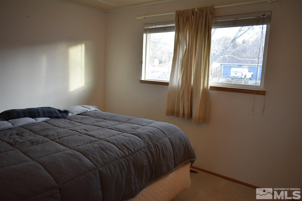 9355 Pagoda Way Reno, NV 89506 - Photo 9 of 18 a bedroom with a bed and a window