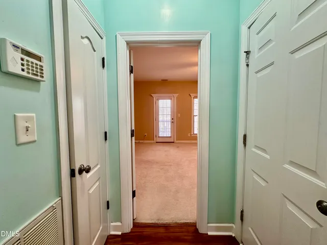 a view of a bathroom from a hallway
