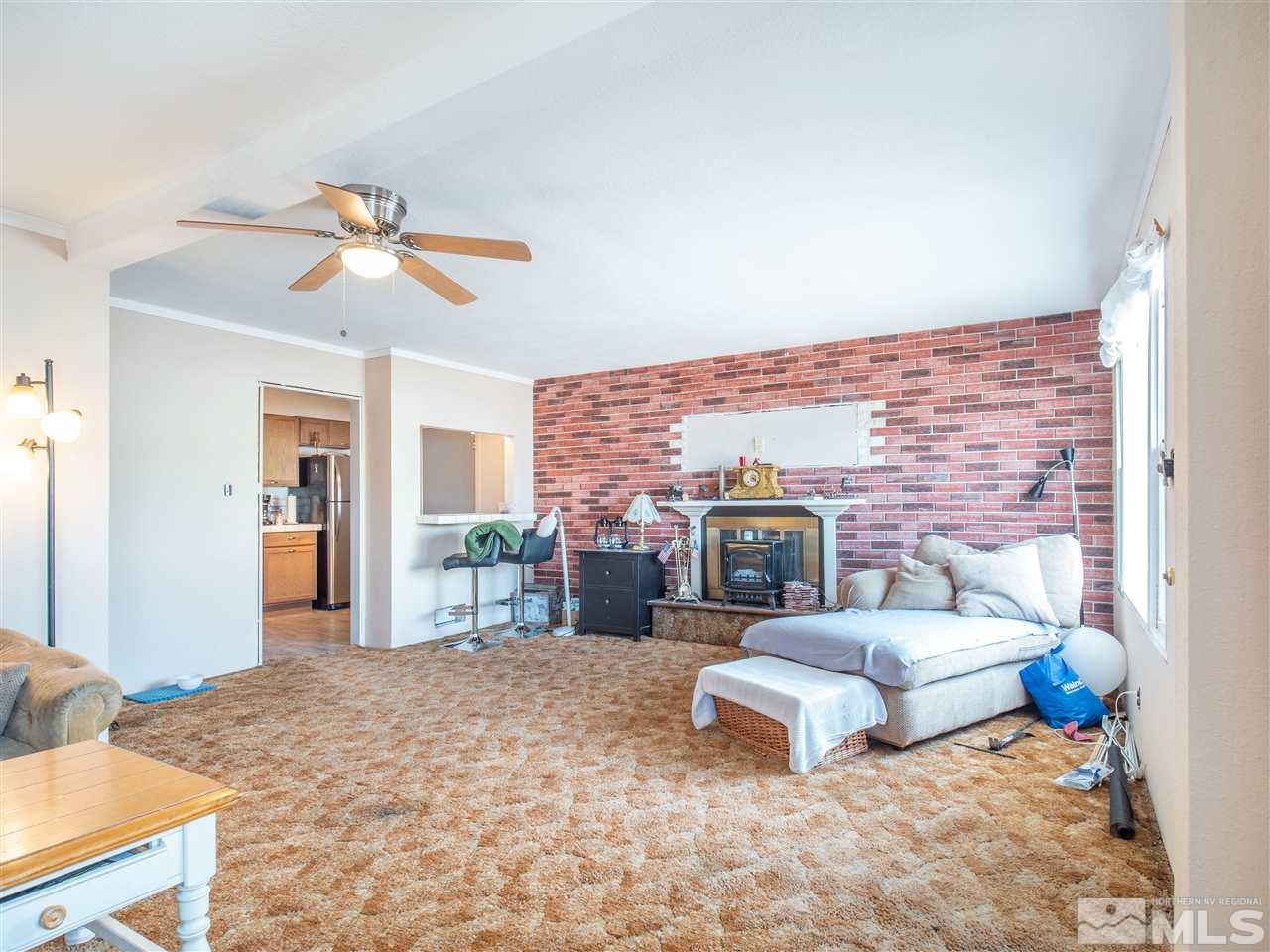 940 Wilkinson Avenue Reno, NV 89502 - Photo 11 of 29 a living room with furniture and a fireplace