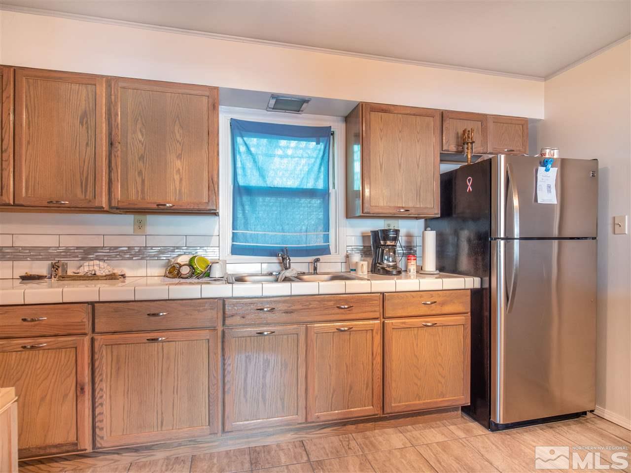 940 Wilkinson Avenue Reno, NV 89502 - Photo 14 of 29 a kitchen with a sink and refrigerator