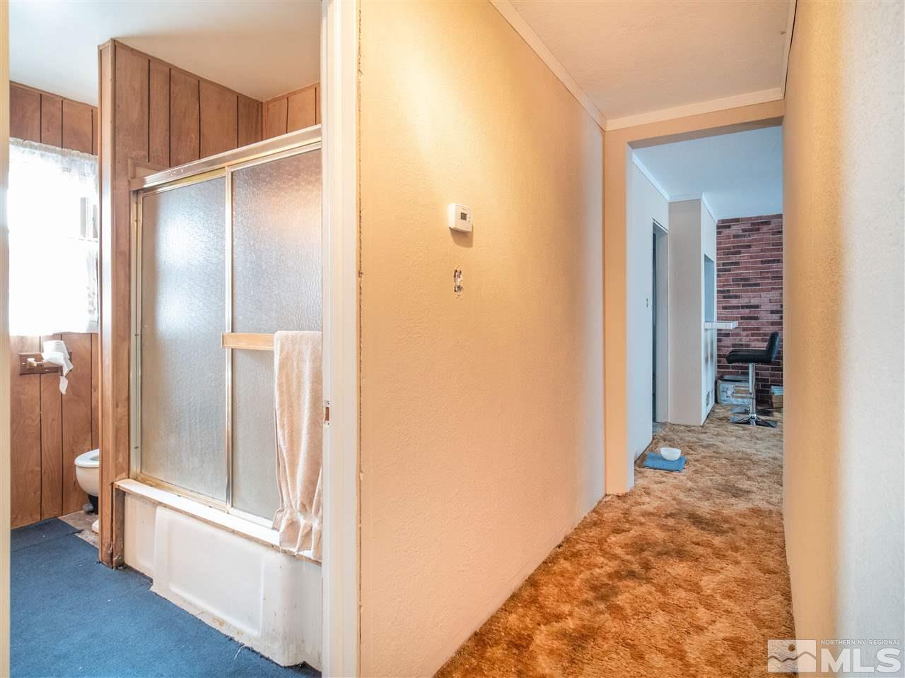940 Wilkinson Avenue Reno, NV 89502 - Photo 16 of 29 a view of a hallway with wooden floor and staircase