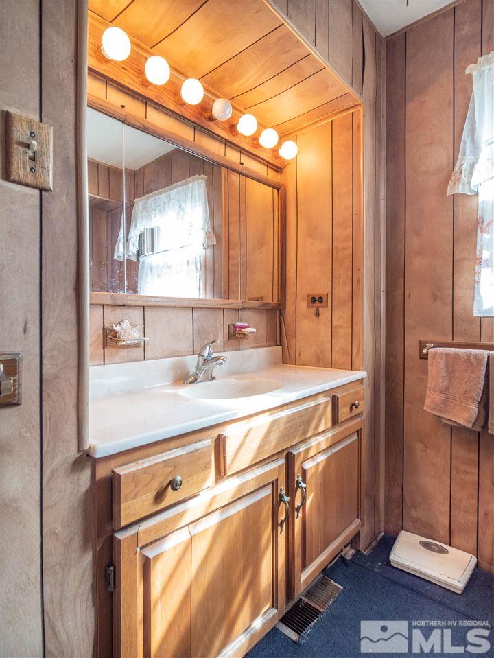 940 Wilkinson Avenue Reno, NV 89502 - Photo 18 of 29 a view of a bathroom with a sink and mirror