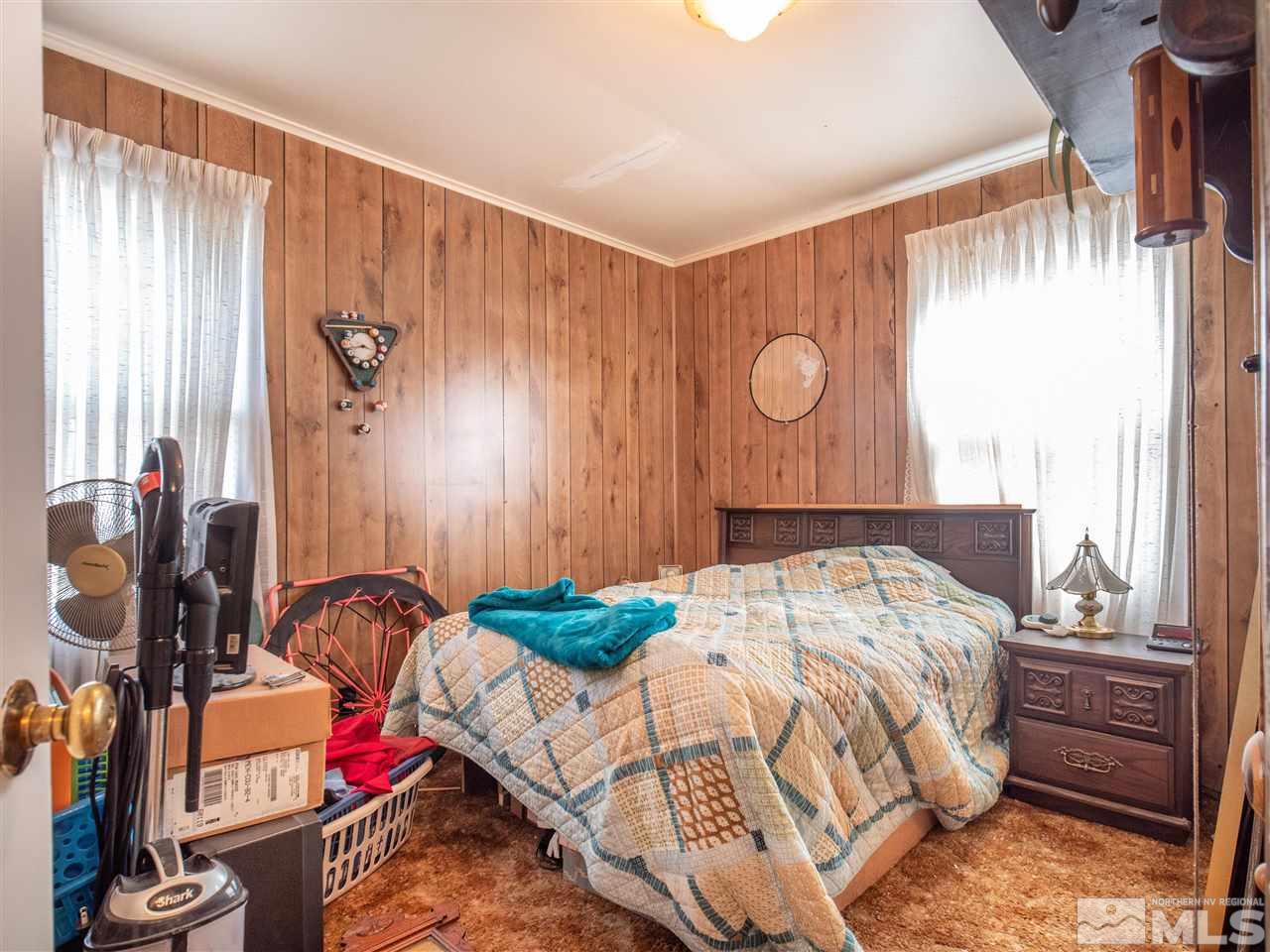 940 Wilkinson Avenue Reno, NV 89502 - Photo 19 of 29 a bed sitting in a bedroom next to a window