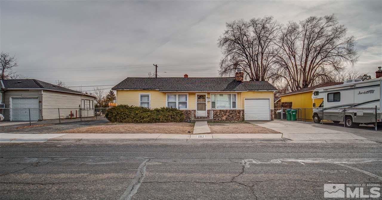 940 Wilkinson Avenue Reno, NV 89502 - Photo 2 of 29 a front view of a house with a yard and garage