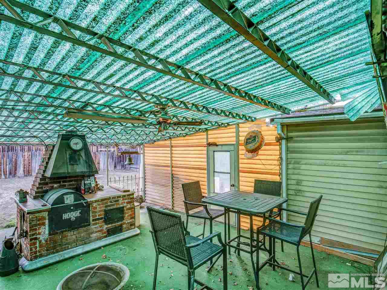 940 Wilkinson Avenue Reno, NV 89502 - Photo 27 of 29 a backyard of a house with table and chairs