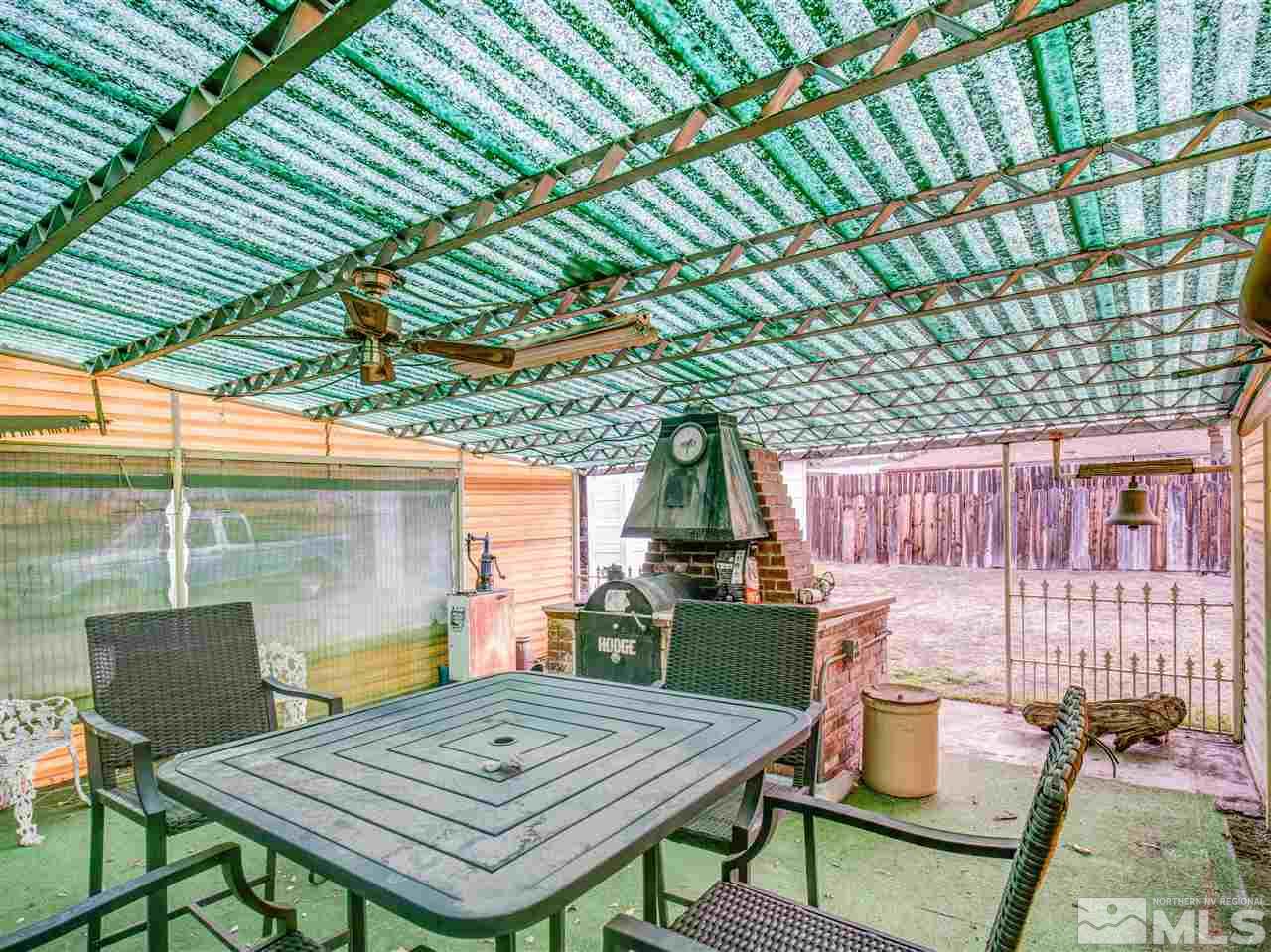 940 Wilkinson Avenue Reno, NV 89502 - Photo 28 of 29 a view of a patio with table and chairs and wooden floor