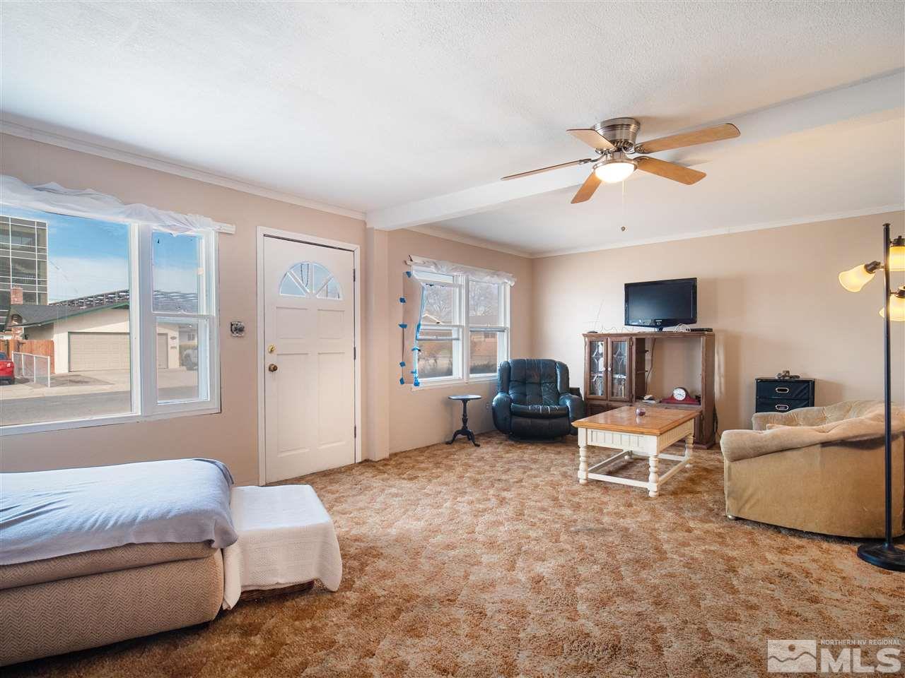 940 Wilkinson Avenue Reno, NV 89502 - Photo 7 of 29 a living room with furniture and a flat screen tv