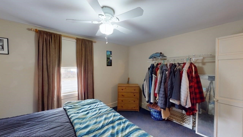 14 Jones Avenue Pawtucket, RI 02861 - Photo 12 of 32 a view of a bedroom with clothes and shoes