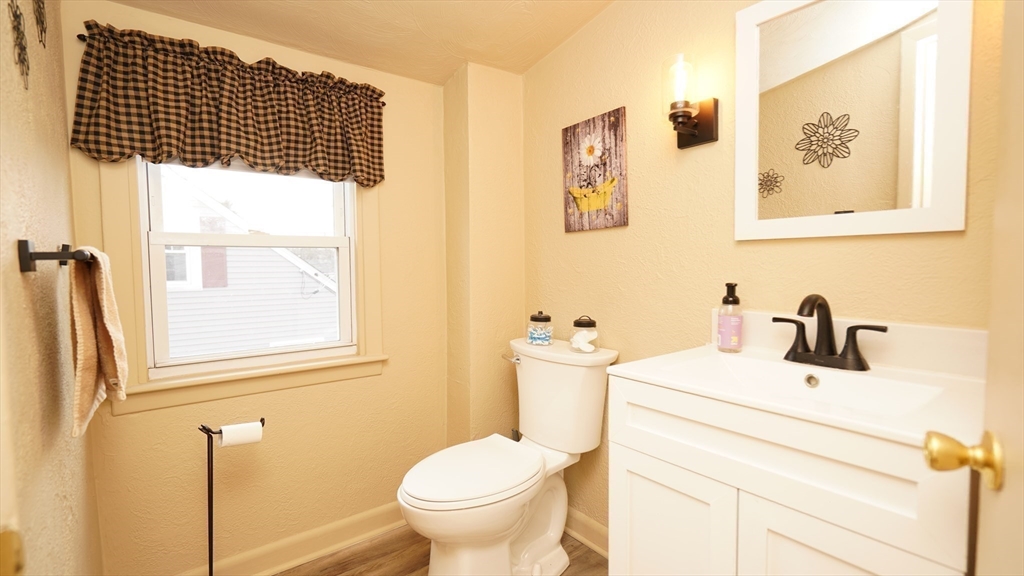 14 Jones Avenue Pawtucket, RI 02861 - Photo 13 of 32 a bathroom with a sink and a toilet