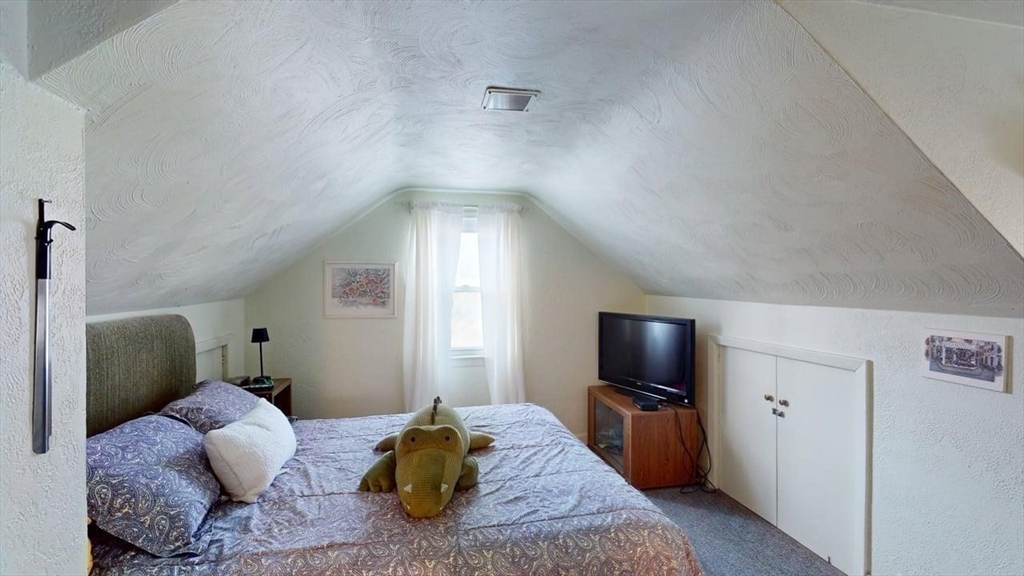 14 Jones Avenue Pawtucket, RI 02861 - Photo 18 of 32 a bedroom with a bed and a television