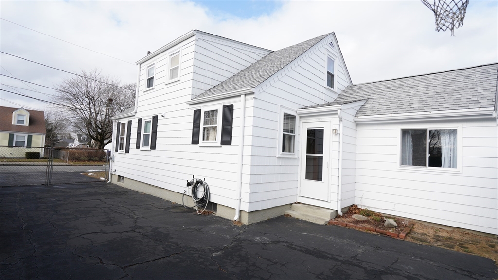 14 Jones Avenue Pawtucket, RI 02861 - Photo 3 of 32 a view of a house with a backyard