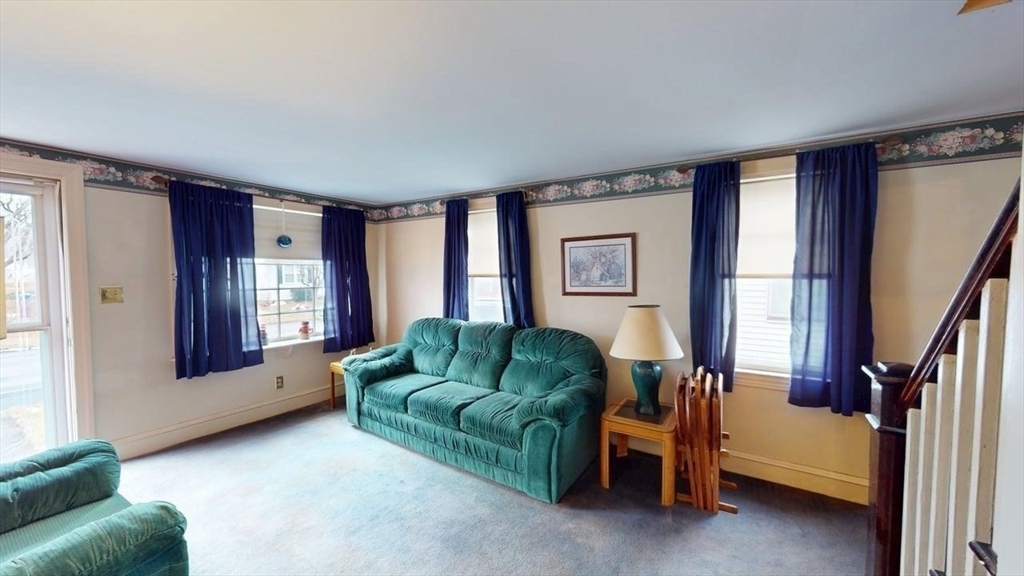 14 Jones Avenue Pawtucket, RI 02861 - Photo 8 of 32 a living room with furniture and a window