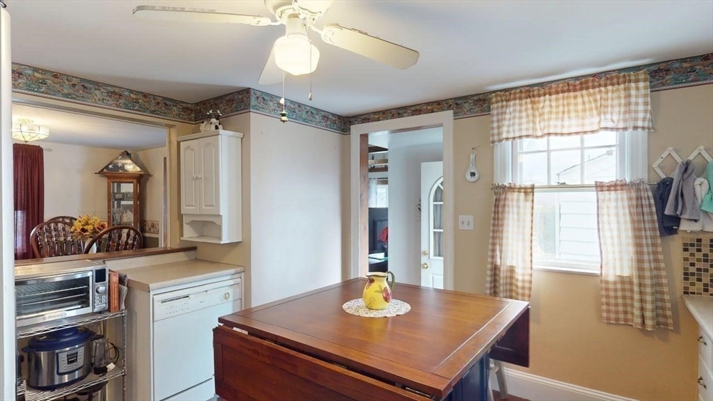 14 Jones Avenue Pawtucket, RI 02861 - Photo 10 of 32 a view of a dining room with furniture and a chandelier