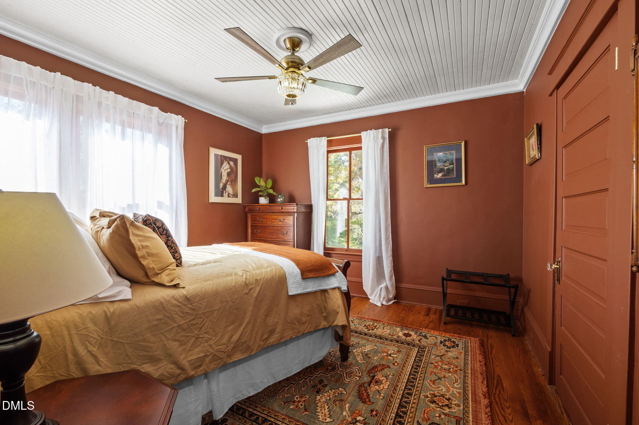 7891 Boston Road Roxboro, NC 27574 - Photo 51 of 85 a bedroom with a bed and wooden floor