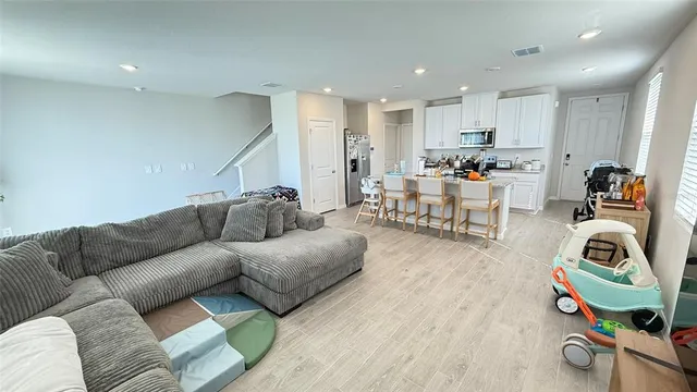a living room with furniture and a couch